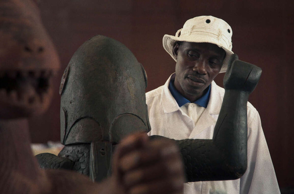 Signing to the scupltures in Dahomey