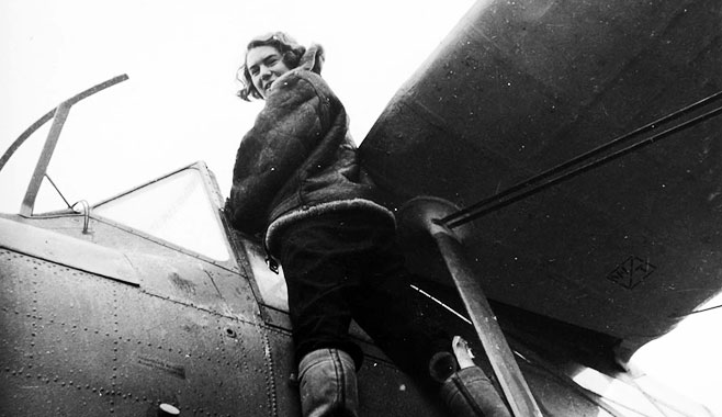 Lee Miller, WRNS Pilot Anne Douglas climbs into an Albacore aircraft, White Waltham, Berkshire, England, 1942