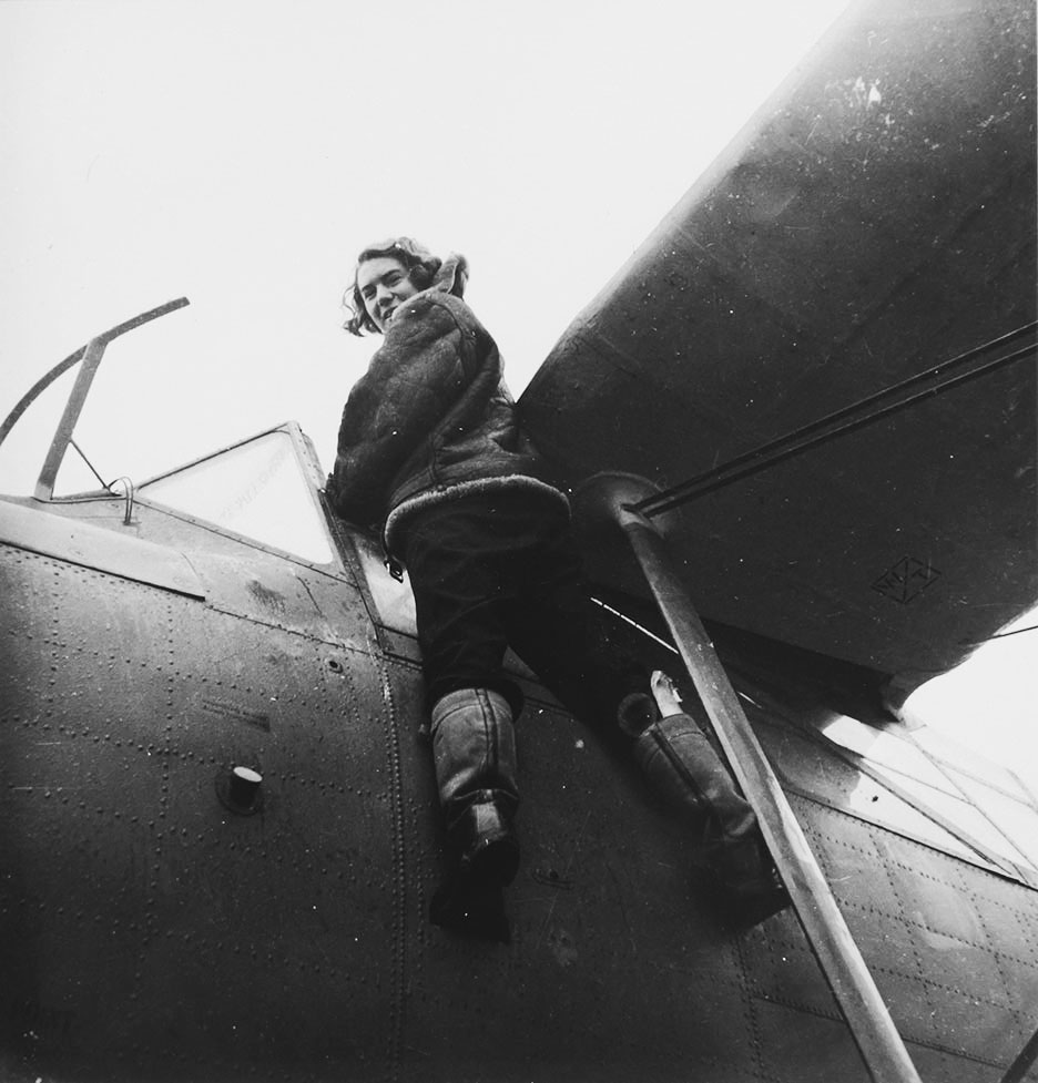Lee Miller, WRNS Pilot Anne Douglas climbs into an Albacore aircraft, White Waltham, Berkshire, England, 1942