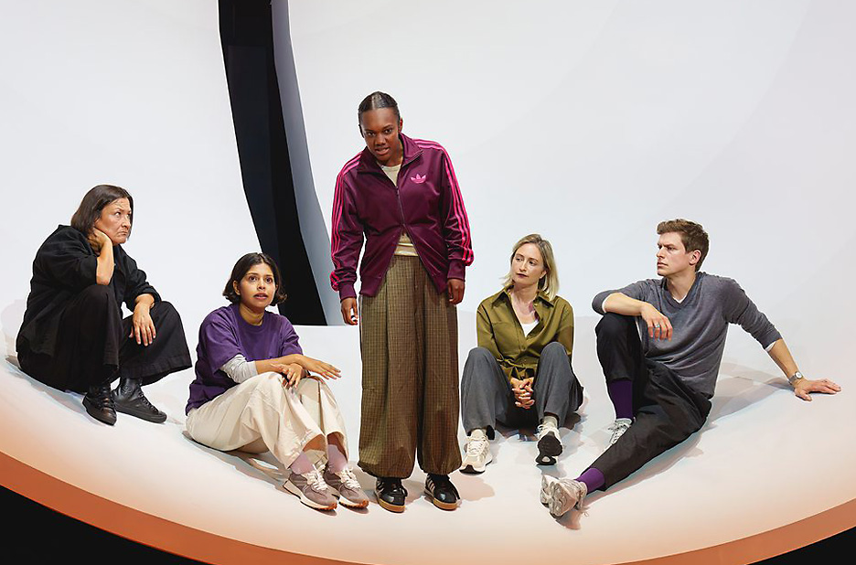 Nina Casselis as Antigone with the rest of the ensemble in Antigone exits at Chichester Theatre (Credit Andy Paradise)